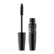 Black mascara with brush and 'glo Skin Beauty' branding on a white background